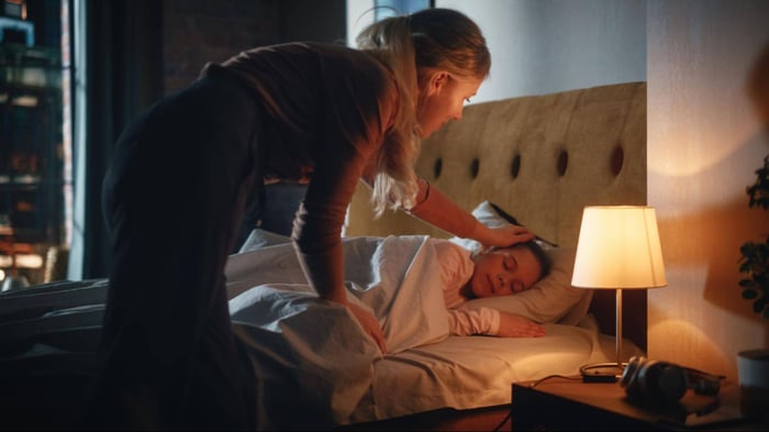 A Mom Trying Wake Up Her Child to Go to School