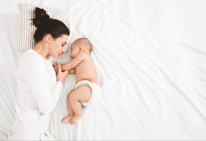 Woman and Baby Bonding in Bed