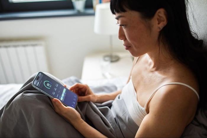 Woman Monitoring Her Sleep Score