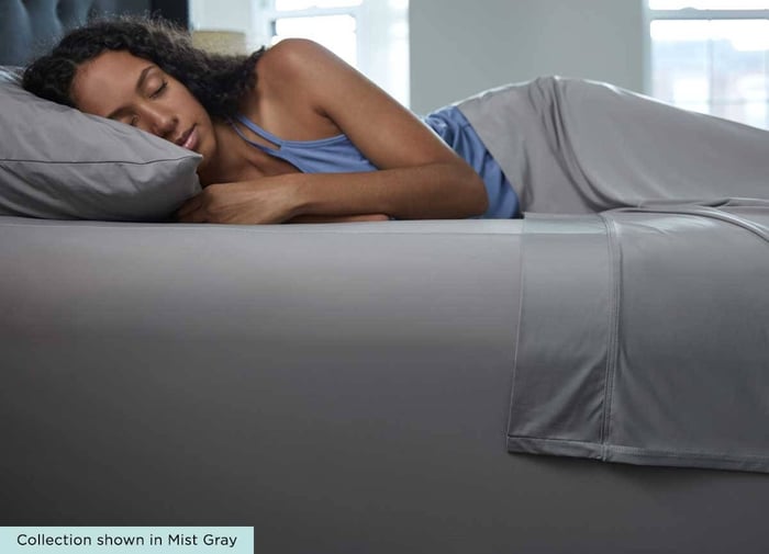 Woman Sleeping Comfortably in SHEEX bed sheets that regulate her body temperature