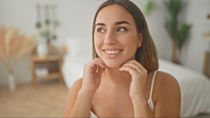 Woman Thats Thinking About Her Wellness in Her Bedroom