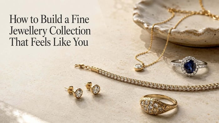 A personal collection of natural diamond and gemstone jewellery arranged on a warm ivory dressing table.