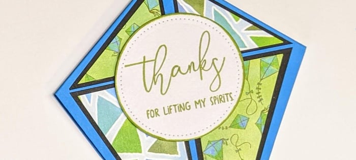 Fold your way to a fun kite-shaped card!