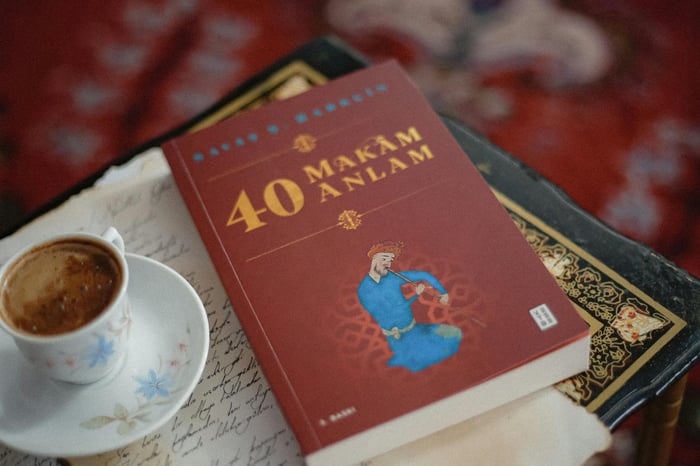 Artistic coffee and book scene on rug