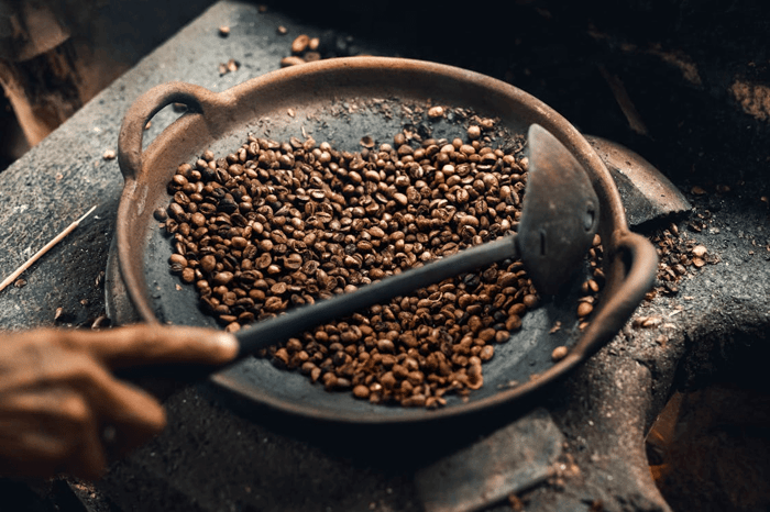 Traditional hand-roasting process of coffee beans