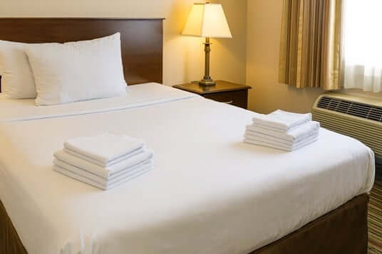 Which Store Offers Flat Sheets in Bulk for a Hotel?