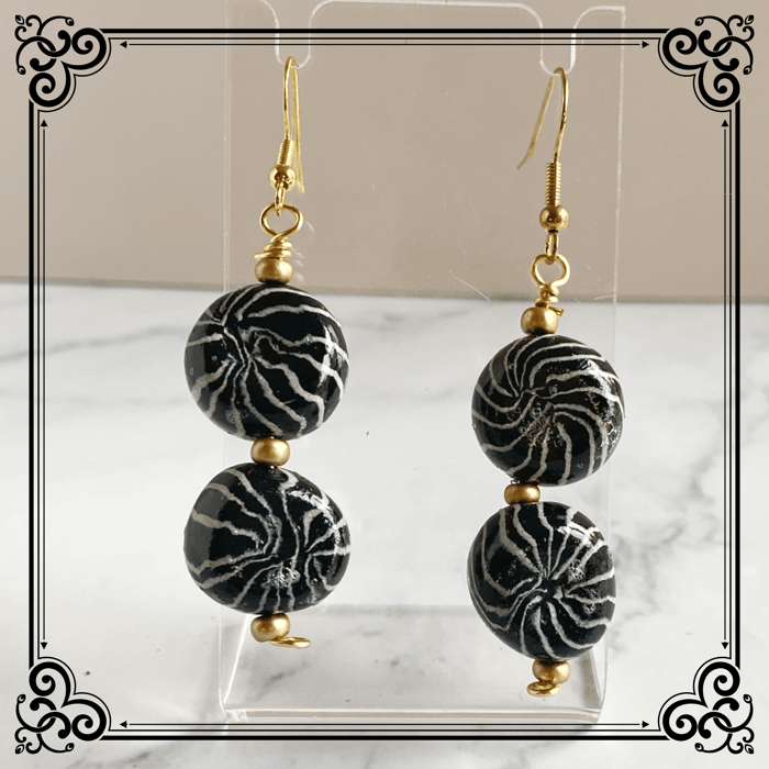 Pretty polymer clay earrings, each with 2 black and white star beads