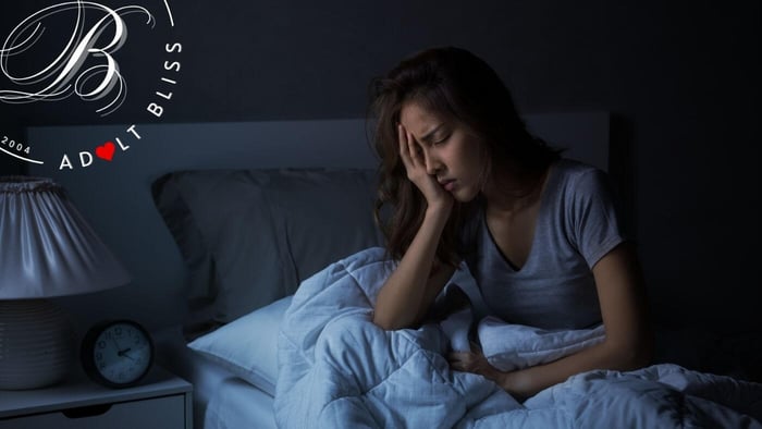 Why Does My Vagina Hurt After Sex young Asian women sitting in bet looking uncomfortable and tiered