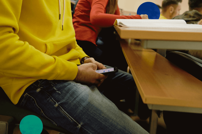 Header Image for Cheat on a StraighterLine Exam? Not a Chance: Student Hiding Phone Under Desk