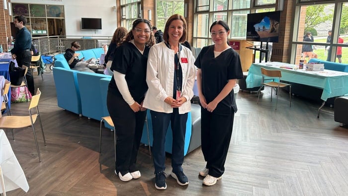 Clinical Assistant Nursing Professor JoAn Kivlehan, along with several nursing students