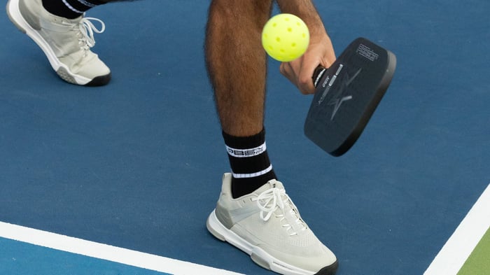 Close up shot of pickleball about to hit a racket