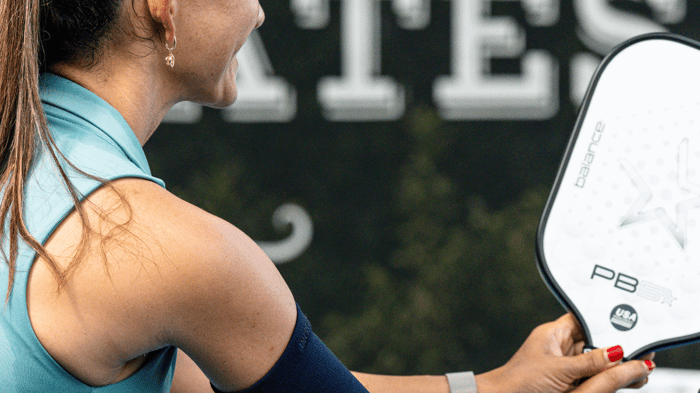 Pickleball player holding a paddle