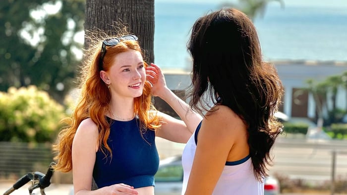 Two pickleball players discussing their pickleball plans