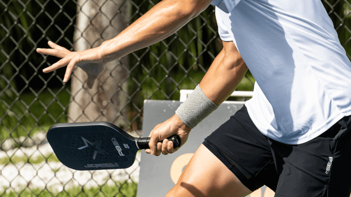 Pickleball player taking a swing