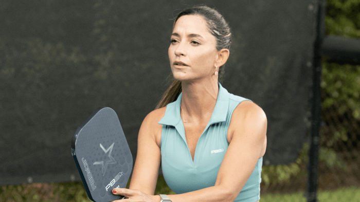 Pickleball player holding a paddle