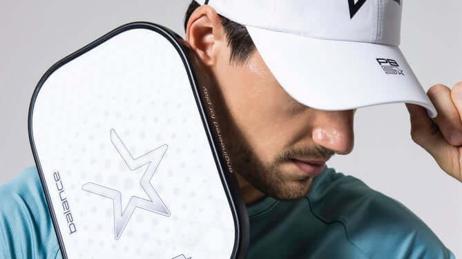 Man modeling PB5 paddle and cap