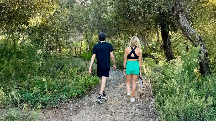 Two players on a stroll after a pickleball game