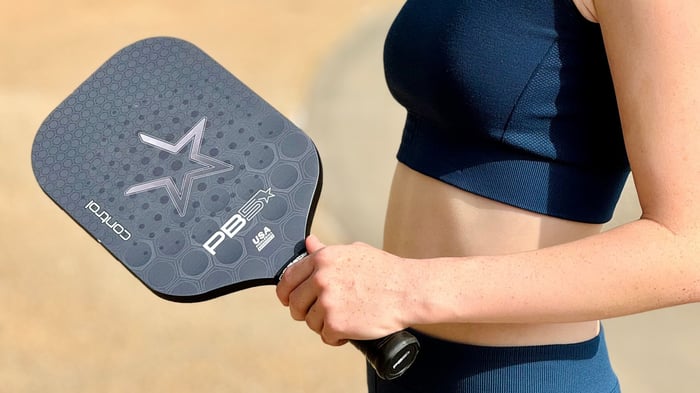 Woman holding PB5star Control paddle