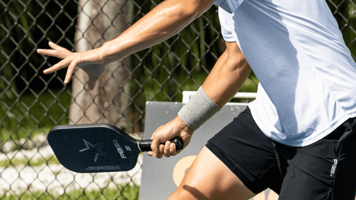 Pickleball player returning a shot