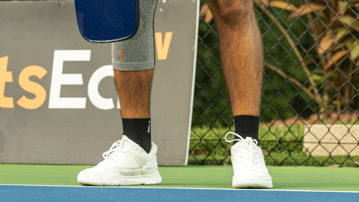 Pickleball player standing on a court