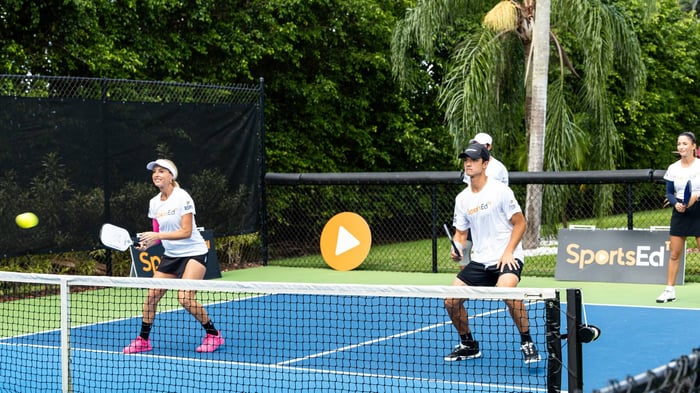 Doubles pickleball game on the court