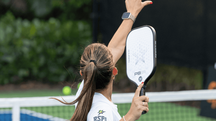Pickleball player taking a shot