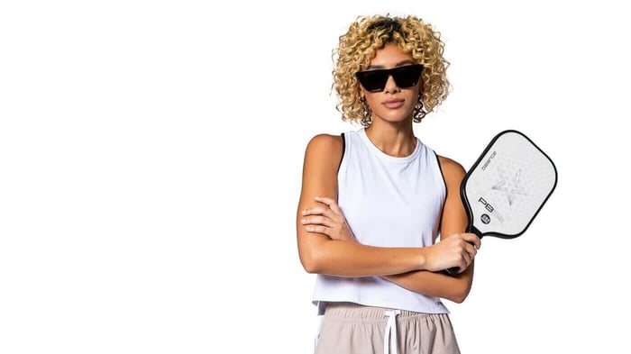 Woman holding PB5star balance paddle