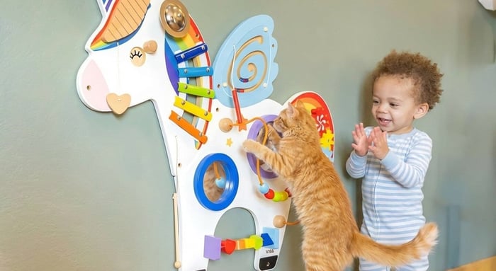 Toddler Wall toys with cat jumping on it