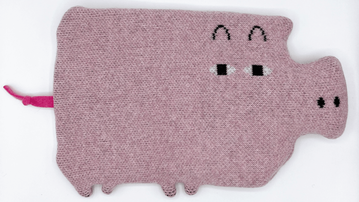 Eco-friendly lambswool pig hot water bottle by Donna Wilson, handcrafted with sustainable materials
