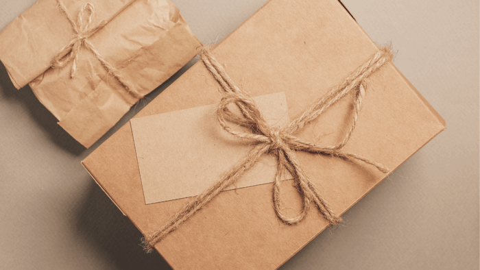 Eco-friendly gifts wrapped in kraft paper and twine, representing sustainable options for non-eco-friendly people