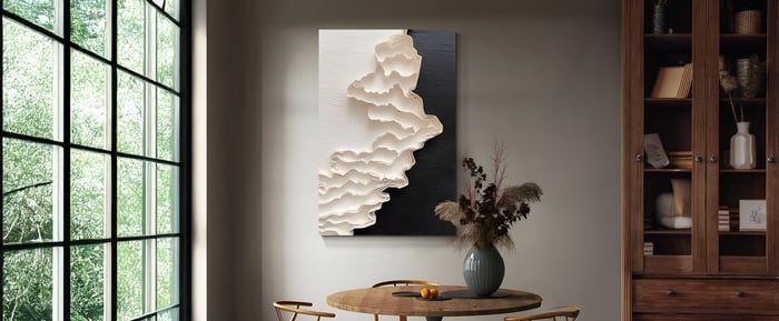 Canvas Art: A cozy dining nook featuring a textured wall art piece with layered white elements against a dark backdrop, adding depth to the space.