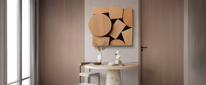 A minimalist dining area with a round table, chairs, and geometric wooden wall art on a wood-paneled wall.