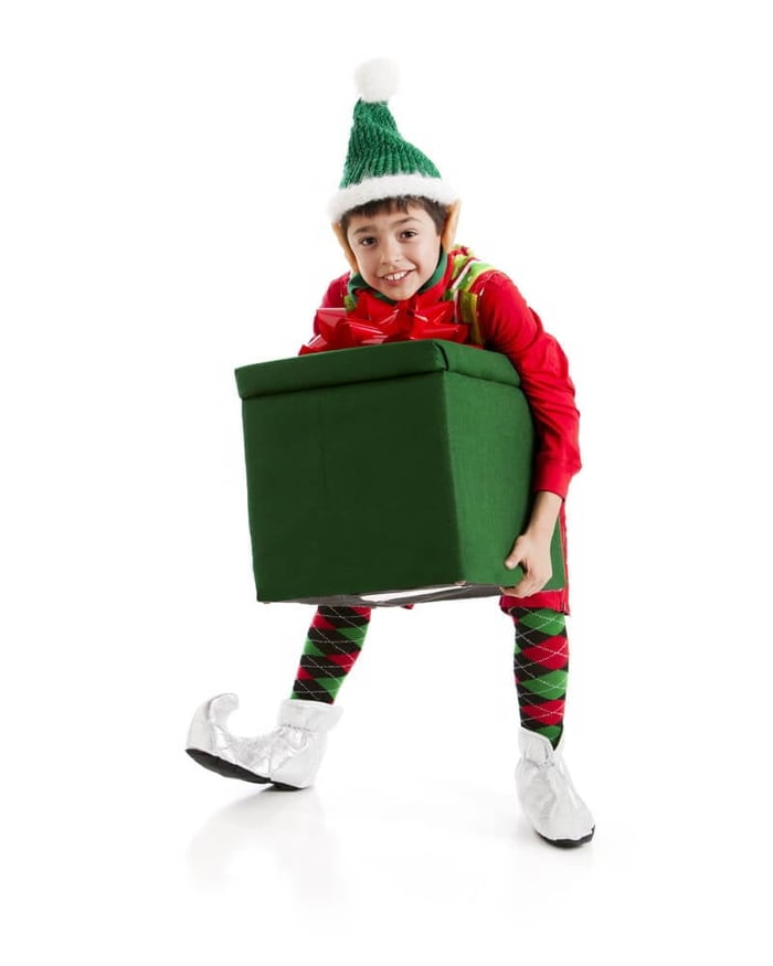 elf getting ready to prank Santa Claus