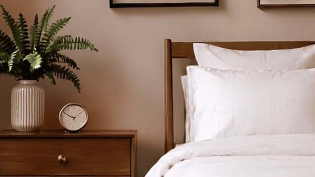 Woman sleeping under Organic vs Synthetic Comforters comparison bedding