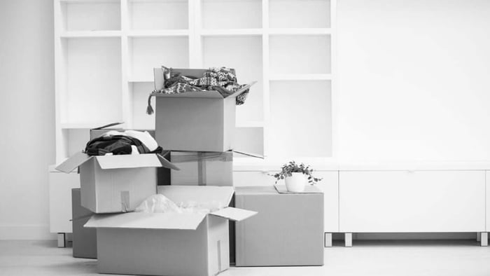 Moving boxes in empty room