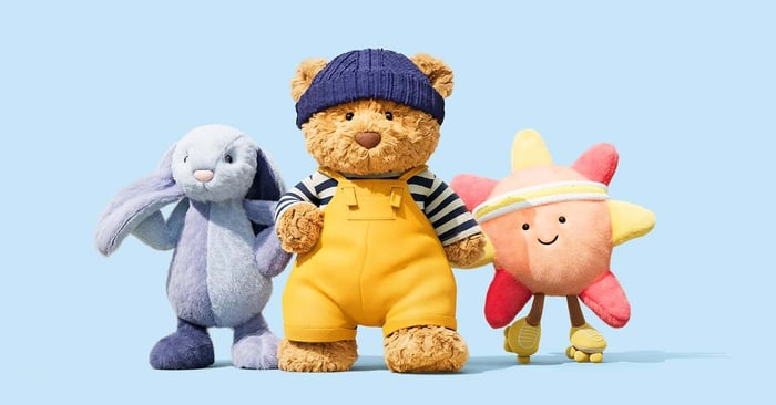 Bartholomew Bear Puddlesea Bunny and  Amuseables Sun Roller Skates in front of a blue background