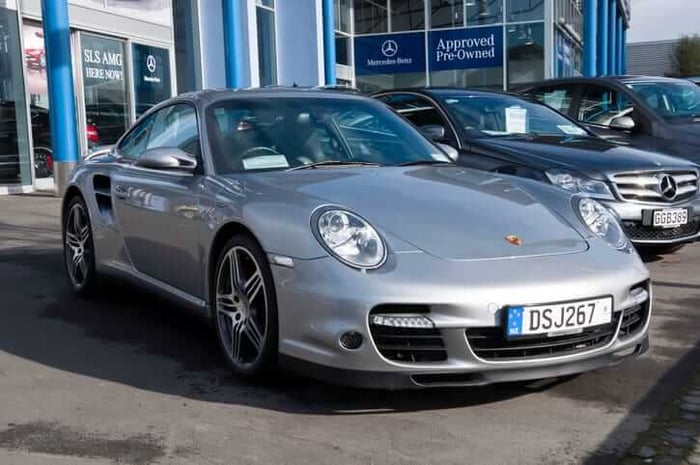Speed Demons vs. Grand Tourers: Porsche 911 Turbo S Unleashed vs. Aston Martin DB11 AMR