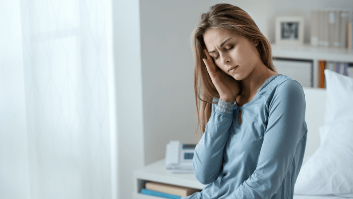 Woman exploring natural migraine relief options
