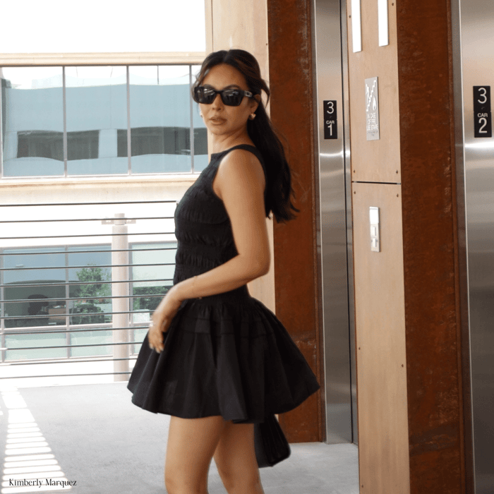 Kimberly Marquez wearing ANEA HILL vineyard sunglasses coming out of an elevator and understanding that quality over quantity sunglasses is best