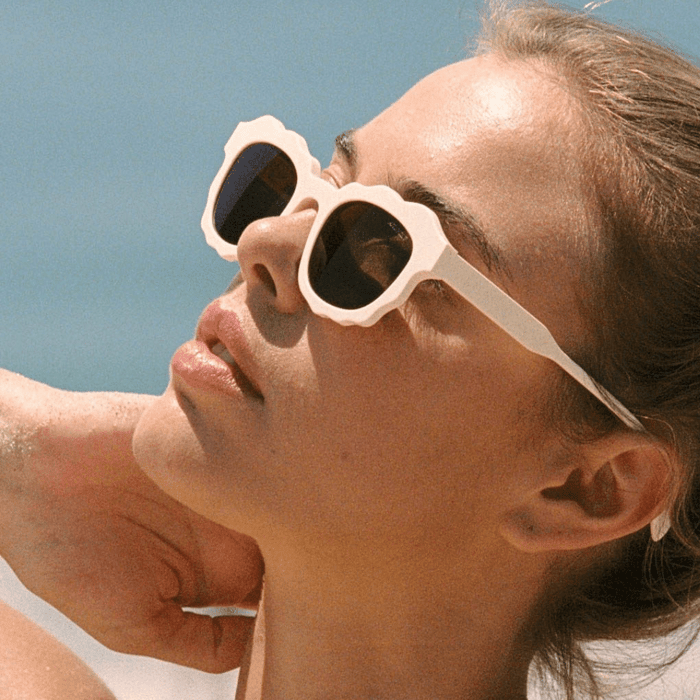 Model wearing Anea Hill polarized sunglasses featured in our blog guide to glare reduction and everyday comfort