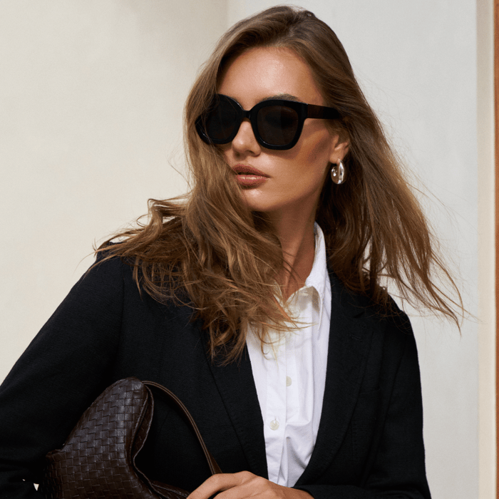 Elegant woman wearing the Estate sunglasses from ANEA HILL, showcasing the luxurious design and sophisticated style of sunglasses for women.