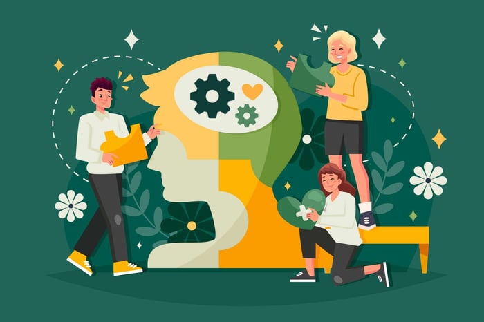 A recruiter demonstrating emotional intelligence in hiring by actively listening to a candidate in a modern office setting