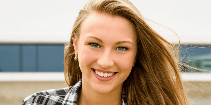 Clean Makeup trends for teens. Teen wearing clean makeup trends with dewy skin glossy lips and soft natural beauty look