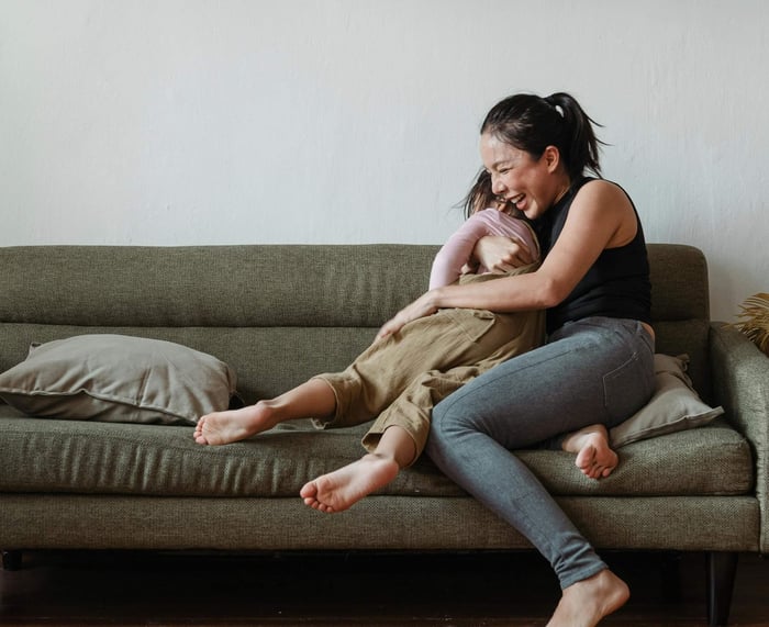 mother plays with her kid - parenting