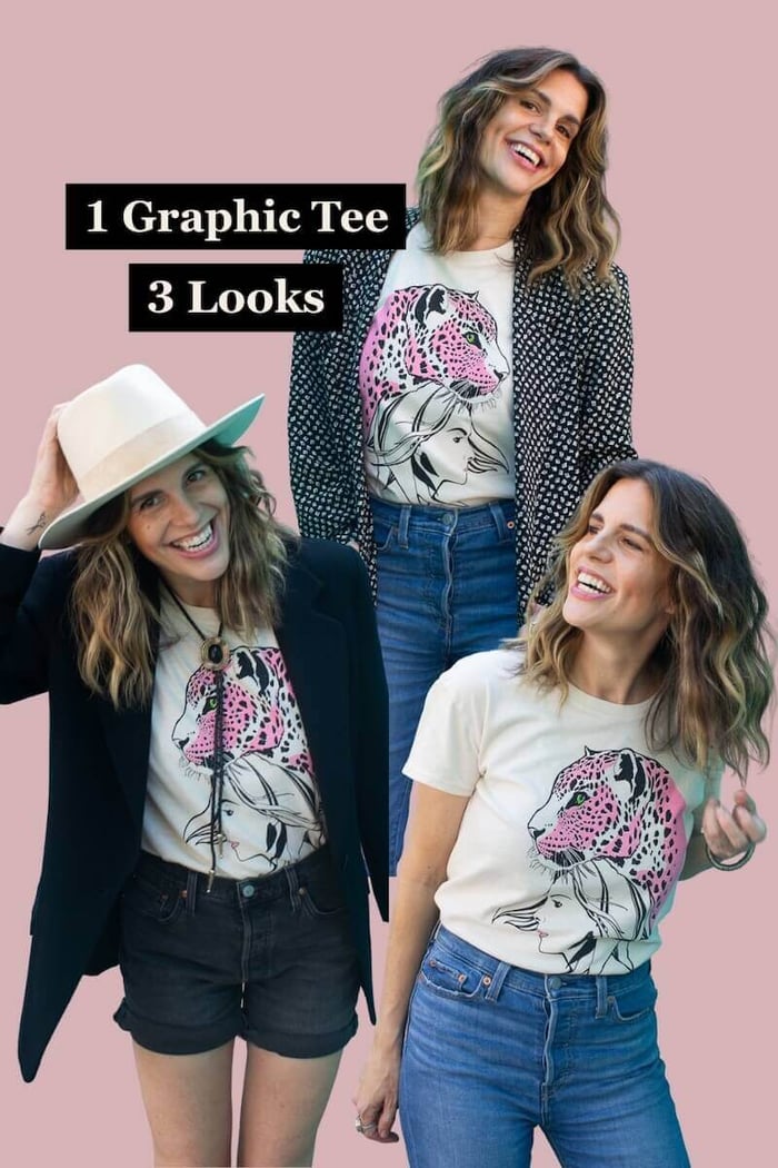 Angela showing how to style a graphic tee in the Wild Within design with denim shorts, a black blazer, and cowboy hat.