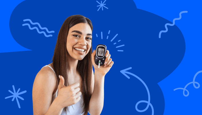 a young woman giving a thumbs up to a blood sugar meter