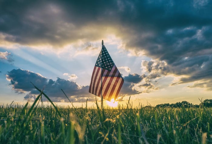 Memorial Day Remembrance Sunset USA Flag in a greenery