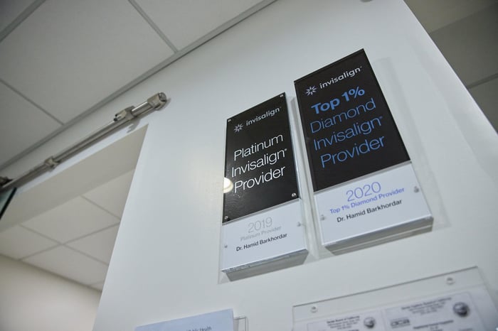 A wall with two dental poster