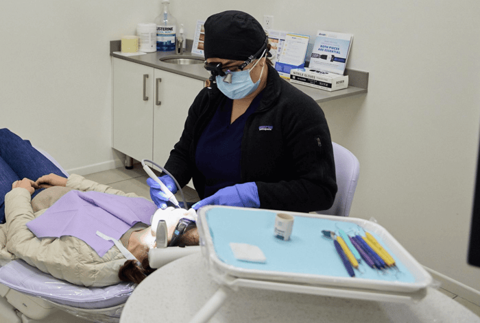 A dentist working on a patient