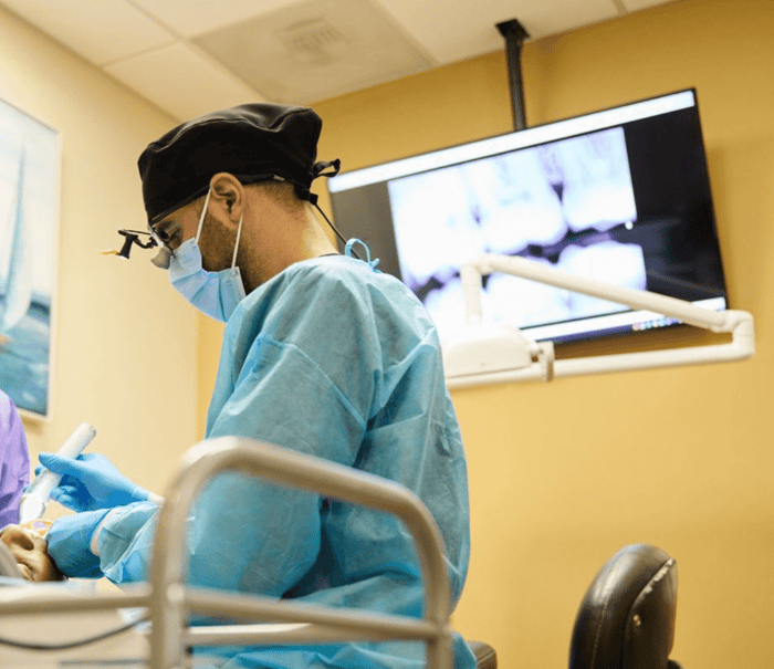 A dentist working on a patient